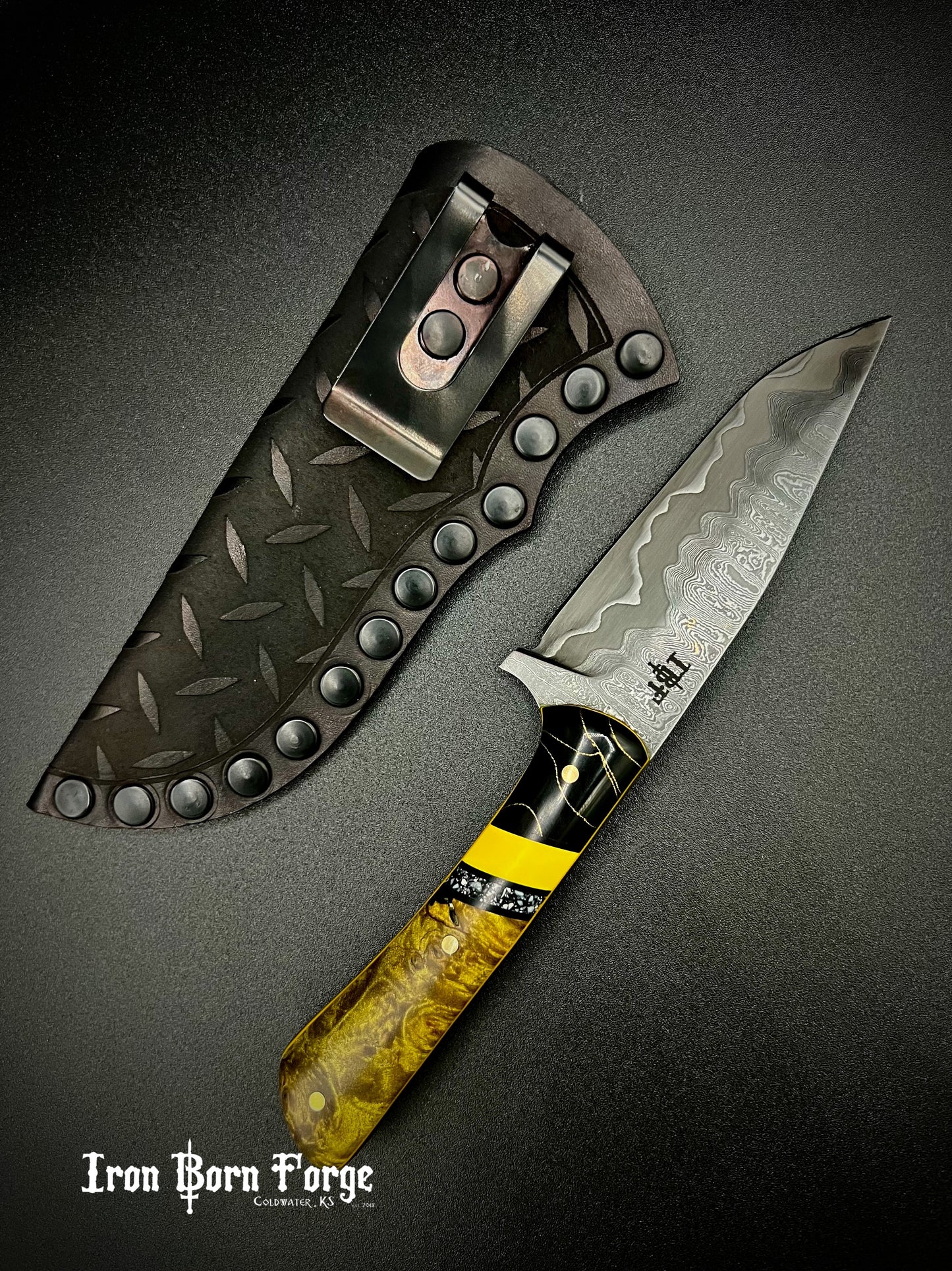 Damascus cladded drop point